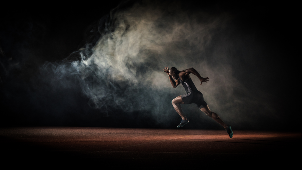 Man sprinting for health toward light kicking up dust