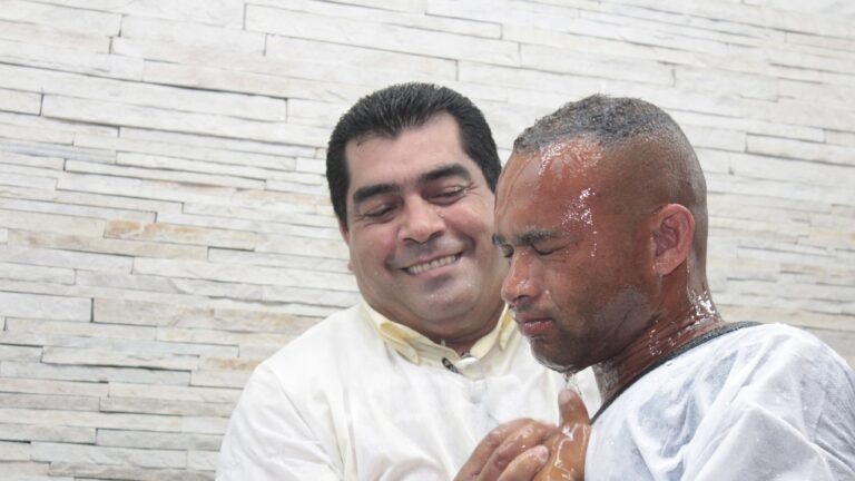 Man being baptised.